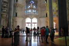 Health workers, police officers and NGO staff members with their families visit the Sagrada Familia basilica as it reopens following the coronavirus disease (COVID-19) outbreak, in Barcelona, Spain, July 4, 2020. 