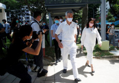 Face masks and fist bumps: Singapore's pandemic poll