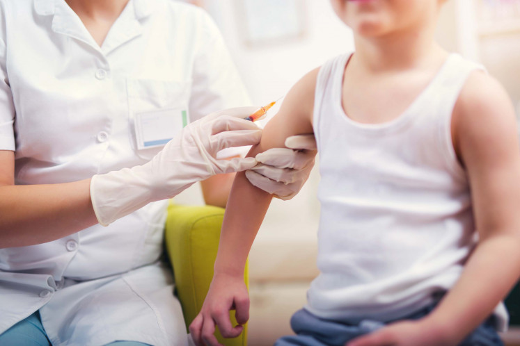 This won't hurt: A young boy gets vaccinated to protect him from various diseases. 