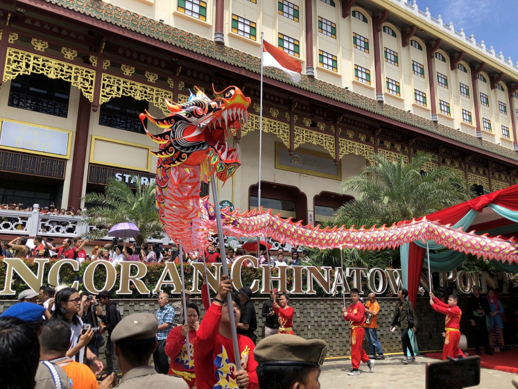 Colorful: Liong (dragon) dance being performed during the Cap Go Meh festival at Pancoran Chinatown Point, in Glodok, West Jakarta on Feb. 8.