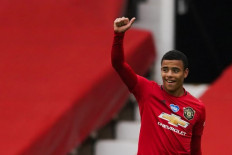 Manchester United's English striker Mason Greenwood celebrates after scoring a goal eduring the English Premier League football match between Manchester United and Bournemouth at Old Trafford in Manchester, north west England, on July 4, 2020. 