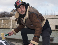 French street artist Wilfrid Azencoth in Paris on February 8, 2015.
