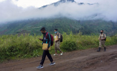 SMP 4 Bawang teachers walk dozens of kilometers to drop off weekly assignments at students’ homes in Batang regency, Central Java. JP/Harviyan Perdana Putra