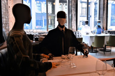 Mannequins do double duty in a chic restaurant in virus-hit Montreal