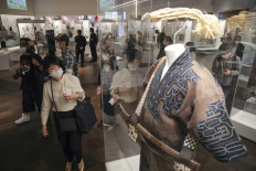 Visitors look at various exhibitions at the new National Ainu Museum and Park in Shiraoi in northern Japan's Hokkaido region on July 12, 2020. 