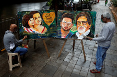 Fans in India pray for Bollywood's Bachchans to recover from COVID-19