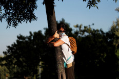 Hugging a tree in Israel to beat the coronavirus blues