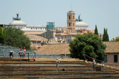 Workers build a seating area for socially distanced Rome Opera House's summer performances at Circus Maximus, the ancient chariot racetrack, following the coronavirus disease (COVID-19) outbreak in Rome, Italy, June 25, 2020.