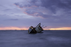 A crew member aboard the KM Mina Rejeki was found dead near the vessel’s cargo hold on Saturday. The ship had capsized the day before after colliding with wreckage at the entrance of Muara Angke Port in North Jakarta.