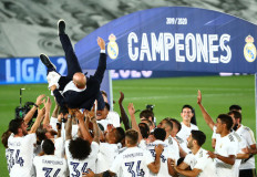 Real Madrid coach Zinedine Zidane is tossed by his players after winning La Liga by defeating Villarreal 2-1 at home, as play resumes behind closed doors following the outbreak of the COVID-19.   