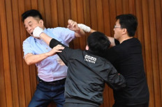 Punches, water balloons thrown in Taiwan parliament melee