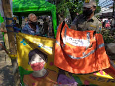 Jakarta ‘must do better’ as it extends PSBB transition