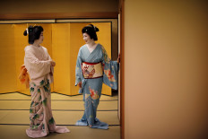 Mayu and Koiku, who are geisha, wait for their customers, who are hosting a party at Asada, a luxury Japanese restaurant, where they will entertain with other geisha, during the coronavirus (COVID-19) outbreak, in Tokyo, Japan, on June 23, 2020. 
