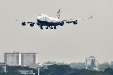 In this file photograph taken on May 3, 2019, a British Airways Boeing 747 passenger aircraft prepares to land at London Heathrow Airport, west of London. 