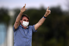 Brazil's Bolsonaro says coronavirus restrictions kill economy