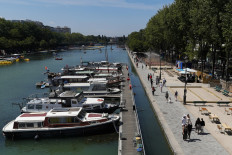 A picture shows a general view of the Bassin de la Villette on the opening day of the 19th edition of the 'Paris-Plages' (Paris Beaches) summer event on July 18, 2020, in Paris. 