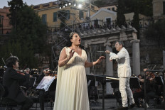 Georgian mezzo-soprano Anita Rachvelishvili (C) performs during a concert organized by the Greek National Opera at the ancient Roman Agora in Athens on July 18, 2020.
