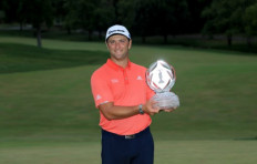 Jon Rahm of Spain celebrates with the trophy after winning during the final round of The Memorial Tournament on July 19, 2020 at Muirfield Village Golf Club in Dublin, Ohio.