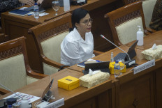 Finance Minister Sri Mulyani Indrawati speaks at a hearing with the House of Representatives in Jakarta on June 29.