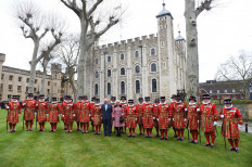 Britain's Prince Charles, Prince of Wales and Britain's Camilla, Duchess of Cornwall pose with members of the Yeoman Warders during their visit to The Tower of London, central London on February 13, 2020, to mark 535 years since the creation of the (Beefeaters) and to celebrate 50 years of the British Tourist Authority.
