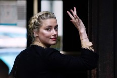 Amber Heard says Johnny Depp threw bottles at her 'like grenades'