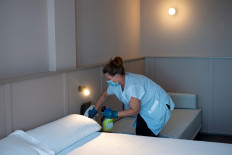A hotel employee cleans a room in Lloret de Mar on June 22, 2020. 