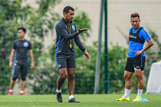 This file photo taken on April 20, 2020 shows Guangzhou R&F's head coach Giovanni van Bronckhorst (center) attending a football training session in Guangzhou in China's southern Guangdong province. Giovanni van Bronckhorst won the Champions League and captained his country to a World Cup final, but the Dutchman told AFP that he is still learning -- and none more so than in recent months in 2020.