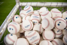 A detailed view of the MLB batting practice baseballs prior to the Opening Day game between the Miami Marlins and the Colorado Rockies at Marlins Park on March 28, 2019 in Miami, Florida.An outbreak of COVID-19 rocked Major League Baseball on Monday, forcing the postponement of multiple games less than a week after the sport launched its season following a four-month coronavirus delay.
