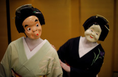 Maki and Ikuko, who are geisha, perform a dance routine for Reuters, as they wait for customers to arrive, who are hosting a party where they will be entertaining with other geisha, at Asada, a luxury Japanese restaurant, during the coronavirus disease (COVID-19) outbreak, in Tokyo, Japan, June 23, 2020. Reuters/Kim Kyung-Hoon 