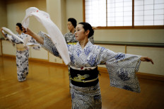 Koiku, Maki, Ikuko and Mayu, who are geisha, perform a dance routine for Reuters, before they work at a party being hosted by customers at Asada, a luxury Japanese restaurant, during the coronavirus disease (COVID-19) outbreak in Tokyo, Japan, June 23, 2020. Reuters/Kim Kyung-Hoon 