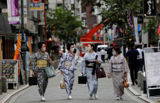 Maki, Mayu, Koiku and Ikuko, who are geisha, wear protective face masks as they walk to a restaurant after attending a dance class, during the coronavirus disease (COVID-19) outbreak, in Tokyo, Japan. July 13, 2020. Ikuko fears an extended pandemic could prompt some geisha to quit. "Now is the worst of the worst", she said. "How are we going to get through? It'll take all of our body and 
soul." Reuters/Kim Kyung-Hoon 
