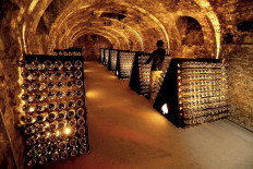 In this file photo taken on November 6, 2014, Bottles of 'Armand de Brignac' Champagne are seen in the cellars of the Cattier champagne family house in Chigny-les-Roses, south of Reims, northeastern France. 
