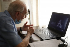 Giuseppe Paterno, 96, Italy's oldest student, takes his final exam online, for his undergraduate degree that he has been studying for in history and philosophy at the University of Palermo, using a laptop at his home, due to social distancing measures implemented during the coronavirus disease (COVID-19) outbreak, in Palermo, Italy, June 23, 2020. 