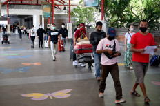 Passengers arrive on the first day of reopening for domestic flights after being temporarily closed due to concerns about COVID-19 at Ngurah Rai International Airport, in Denpasar, Bali, on July 31, 2020.

