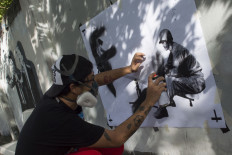 The revolution will be stencilized: 'Thailand's Banksy' won't back down