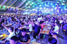 Chinese beer lovers leave facemasks and worries behind as festival opens
