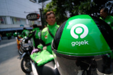 Driver partners of Gojek, the ride-hailing service of GoTo, wait for orders. The transportation and e-commerce company has raised US$1.3 billion from various investors ahead of its anticipated IPO.