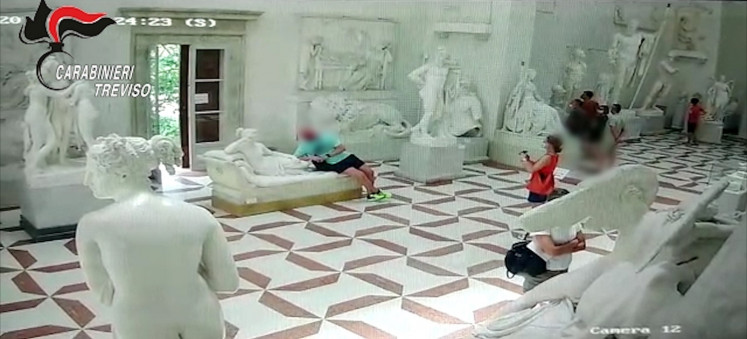 CCTV footage released by Italian police shows a tourist posing for a photograph while leaning on a 19th-century plaster model of 'Paolina Borghese Bonaparte as Venus Victrix' by sculptor Antonio Canova before damaging the toes of the sculpture at the Gypsotheca Antonio Canova museum in Possagno, Italy, on July 31.