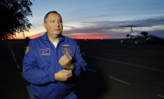 Dmitry Rogozin, the head of the Russian space agency Roscosmos, speaks with the media upon arrival with NASA astronaut Nick Hague and Russian cosmonaut Alexey Ovchinin (both not pictured) in Baikonur, Kazakhstan, on October 11, 2018. 