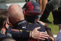 Red Bull's Dutch driver Max Verstappen (right) celebrates with team-mates after winning the F1 70th Anniversary Grand Prix at Silverstone on August 9, 2020 in Northampton. - The race commemorates the 70th anniversary of the inaugural world championship race, held at Silverstone in 1950. 