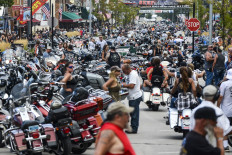 In this file photo taken on August 07, 2020 motorcycles and people crowd Main Street during the 80th Annual Sturgis Motorcycle Rally in Sturgis, South Dakota.