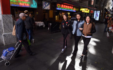 People walk through Sydney's Chinatown on June 21, 2017. 