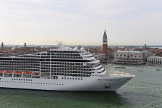 In this file photo taken on June 9, 2019 The MSC Magnifica cruise ship is seen from San Maggiore's bell tower leaving in the Venice Lagoon.
