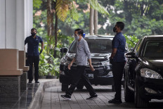 President Joko Widodo arrives at a site in Bandung, West Java on Aug. 11, 2020, where Sinovac's COVID-19 vaccine candidate is undergoing late stage clinical trials.