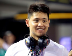 Singapore's Olympic swimmer Joseph Schooling visits the pit during Singapore Formula One Grand Prix at the Marina Bay Street Circuit in Singapore on September 16, 2018. Schooling was handed a fresh national service deferment on Tuesday, allowing him to compete in next year's postponed Tokyo Games.