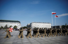 In formation: Soldiers march during a ceremony in which newly sworn-in Polish President Andrzej Duda accepts sovereignty over the Armed Forces for a second five-year term, in Warsaw on Aug. 6. Poland marks this year the centennial anniversary of the Battle of Warsaw.