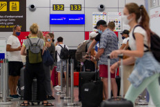 Britons rush home as second virus wave threatens Europe