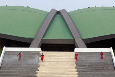 Firefighters spray disinfectant at the House of Representatives complex in Senayan, Central Jakarta, on Aug. 9 in the lead up to the House’s plenary meeting to mark Independence Day. 