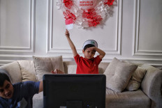 Five-year-old Rashan participates in an online celebration of Indonesia's Independence Day held by Al-Izhar kindergarten in Jakarta on Aug. 17, 2020. Amid the pandemic, residents were told to celebrate the country's 75th anniversary in less-festive ways than usual in Greater Jakarta. 