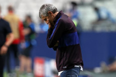 Barcelona's Spanish coach Quique Setien reacts during the UEFA Champions League quarter-final football match between Barcelona and Bayern Munich at the Luz stadium in Lisbon on Aug. 14, 2020.After selling five key players and employing a coach more than happy to take on the established order, Barcelona begin their La Liga campaign at home to Villarreal on Sunday in unchartered territory.